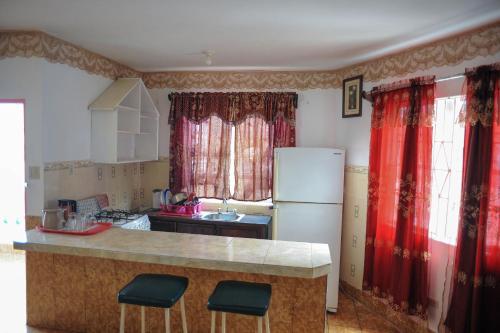 Kuchyň nebo kuchyňský kout v ubytování Glorianna Hotel