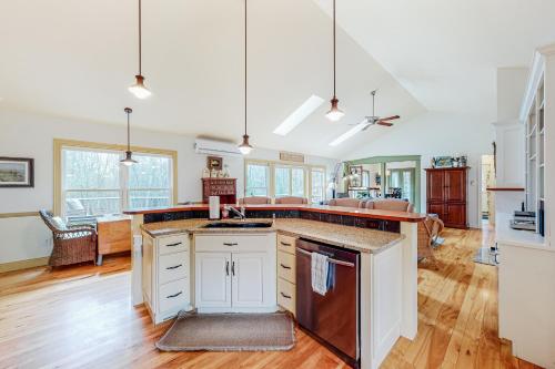 a kitchen with white cabinets and a counter top at Knickerbocker Lake Retreat in Boothbay