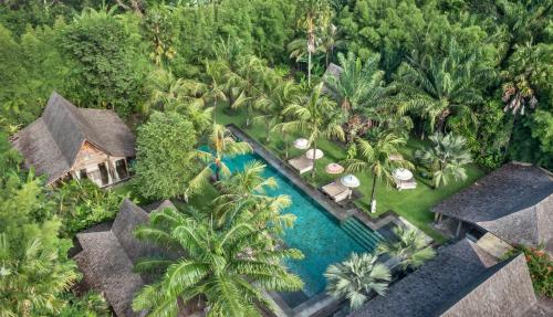 an aerial view of a resort with a swimming pool at The BK Village in Canggu