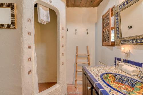a bathroom with a sink and a mirror at Retreat in Taos Foothills in Taos