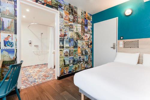 a bedroom with a bed and a bathroom with a shower at hotelF1 Fréjus Roquebrune sur Argens in Roquebrune-sur-Argens