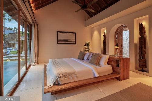 Kama o mga kama sa kuwarto sa Villa Massilia Bali