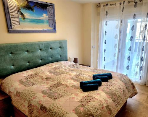 Llit o llits en una habitació de Sidney La Cala 2B