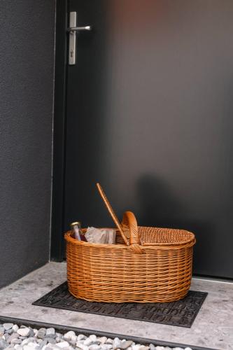 a wicker basket sitting in front of a door at Glamping Senesalina in Kojsko