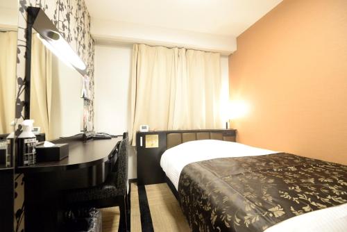 Postel nebo postele na pokoji v ubytování APA Hotel Muroran