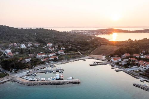 an aerial view of a marina at sunset at Villa Maza in Ždrelac
