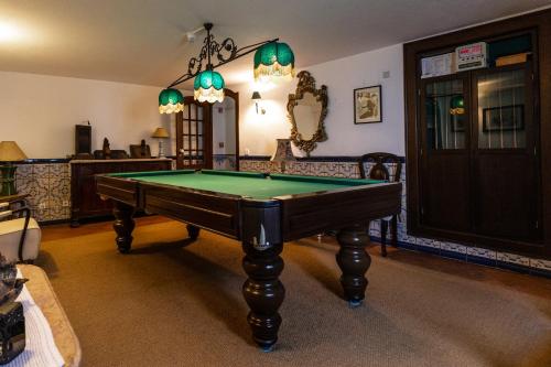 a living room with a pool table in it at Casa de S. Thiago do Castelo in Óbidos