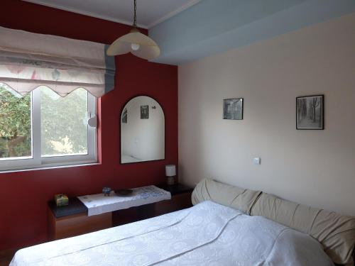 Ένα ή περισσότερα κρεβάτια σε δωμάτιο στο Xylokastro Beachfront Residence
