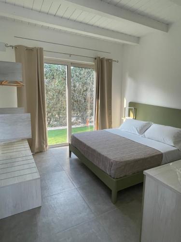 Кровать или кровати в номере Camping Carratois