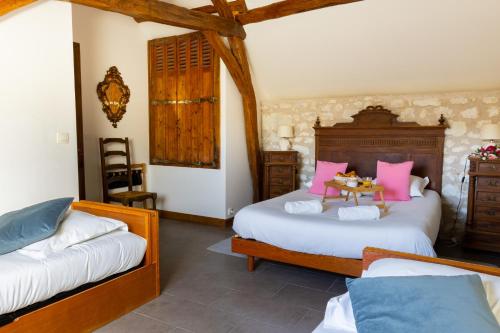 Ένα ή περισσότερα κρεβάτια σε δωμάτιο στο Maison Camilia