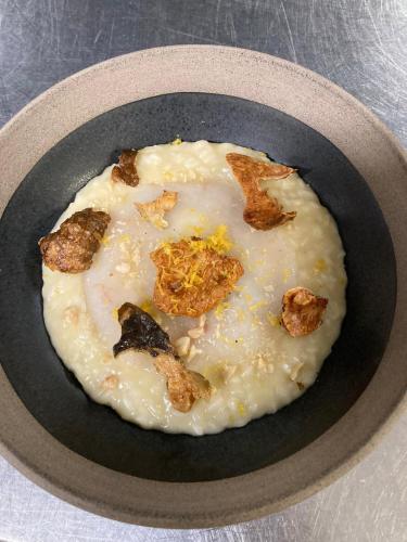 a plate of food in a bowl on a table at Settecento Hotel in Presezzo