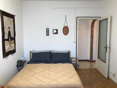 Una cama o camas en una habitación de Muggia Studio 2