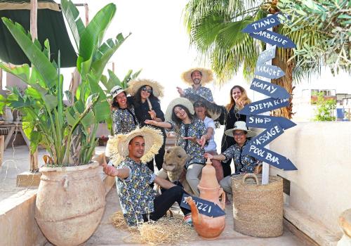 a group of people posing for a picture with street signs at Riad Anyssates in Marrakech