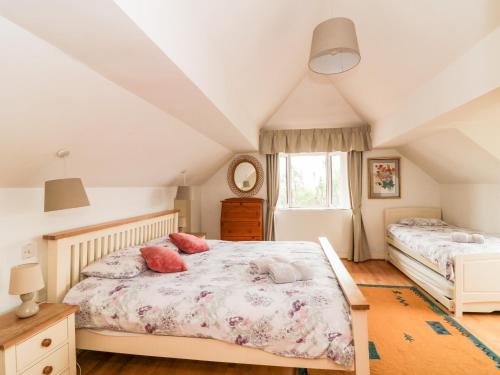 A bed or beds in a room at Ballysheen House