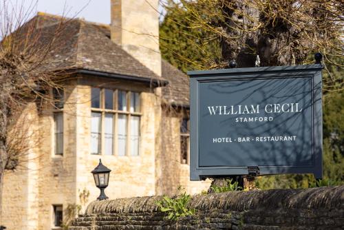 a sign for a william cecil synagogue in front of a house at The William Cecil in Stamford