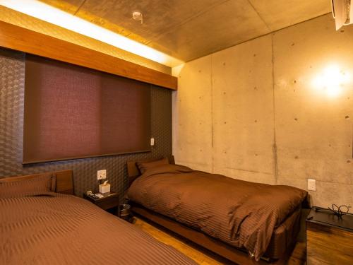 Krevet ili kreveti u jedinici u okviru objekta Kugani-YA.