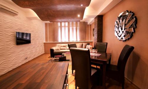 a living room with a couch and a table at Apartments Belgrade in Belgrade