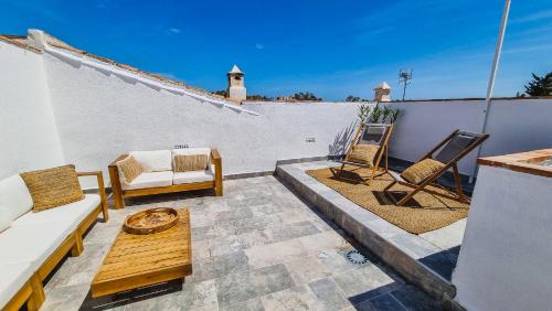 A seating area at Eco Playa Suites - Beach & Golf!