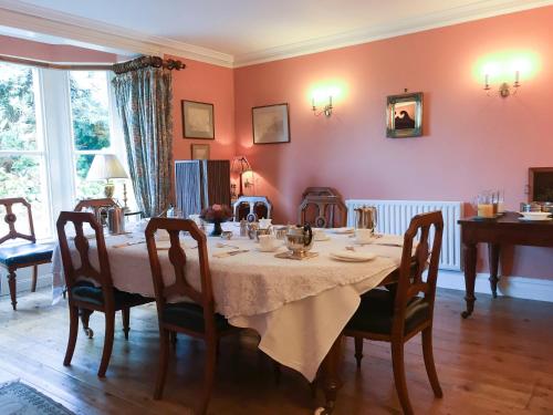 a dining room with a table with chairs and a tableablish at Wood House in Cockermouth