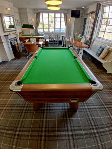 a living room with a pool table in it at Woolpack Inn in Chichester