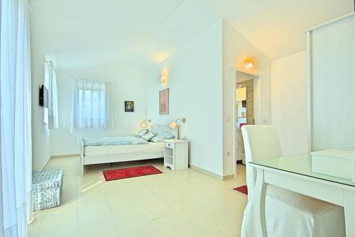 Posteľ alebo postele v izbe v ubytovaní Villa Larisa