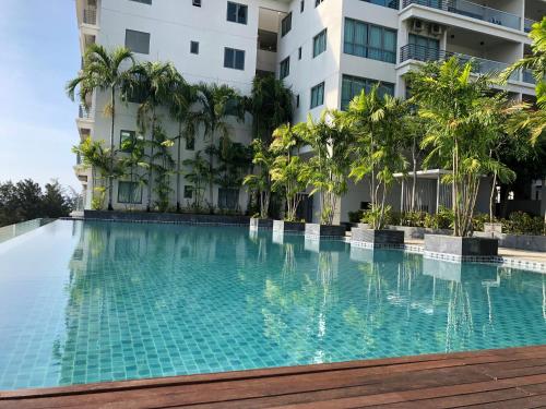 a swimming pool in front of a building at Deco Home @ Imago The Loft in Kota Kinabalu