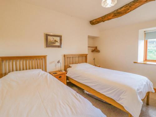 Voodi või voodid majutusasutuse Curlew Cottage toas