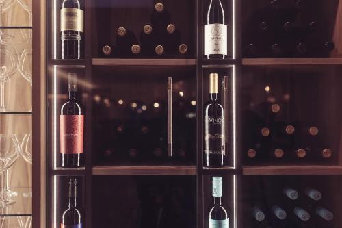 a bunch of wine bottles in a wine cellar at Longlands Inn & Cottages in Carnforth