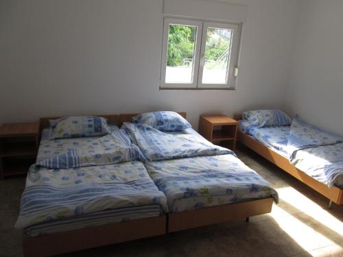 Postel nebo postele na pokoji v ubytování Guest House Sandra