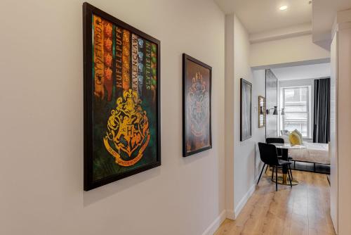 a hallway with paintings on the walls of a room at Les Lofts du Théâtre in Quebec City