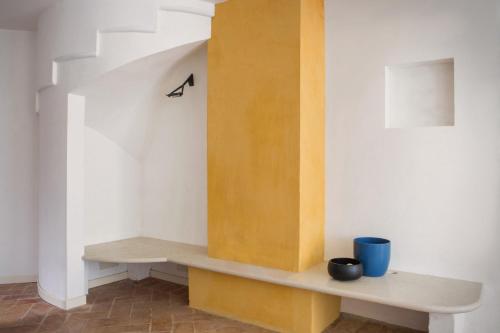 a room with a bench and a stair case at Villa Siresola in Malcesine