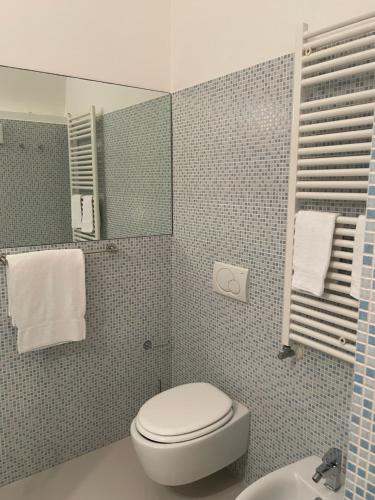 a bathroom with a toilet and a sink at La Casa di Alessia in Camogli
