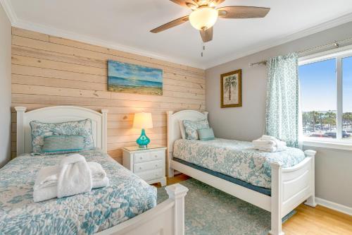 Llit o llits en una habitació de Oceanside 212-C