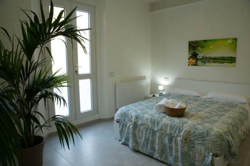 Ένα ή περισσότερα κρεβάτια σε δωμάτιο στο Guest House Oasi Dei Mille