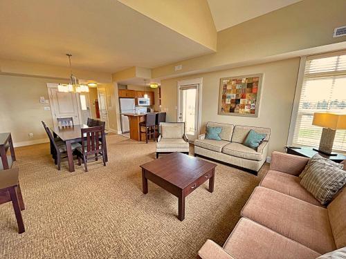 a living room with a couch and a table at Spacious Blue Mountain 2 Storey - Wifi, Pool, Close to the Village & Golf in Blue Mountains
