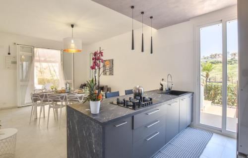 a kitchen with a counter and a dining room at Laila Casa Vacanza in Balestrate