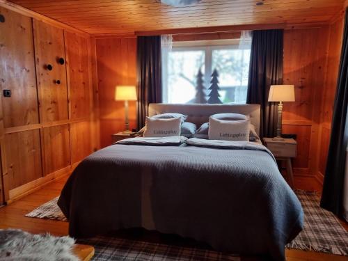 a bedroom with a bed with two pillows on it at Lieblingsplatz - Ski in und Ski out in See