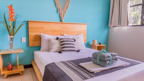 Ein Bett oder Betten in einem Zimmer der Unterkunft Esencia Oaxaca