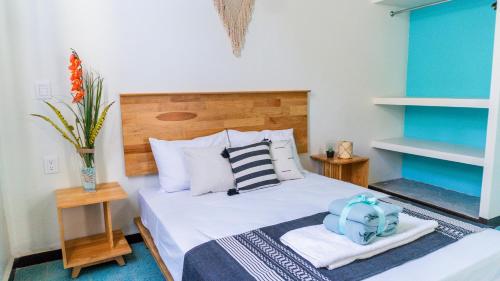 Ein Bett oder Betten in einem Zimmer der Unterkunft Esencia Oaxaca