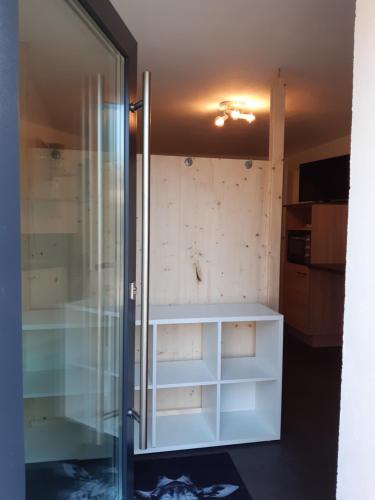 a bathroom with a shower and a glass door at Your BaseCamp! in Roppen