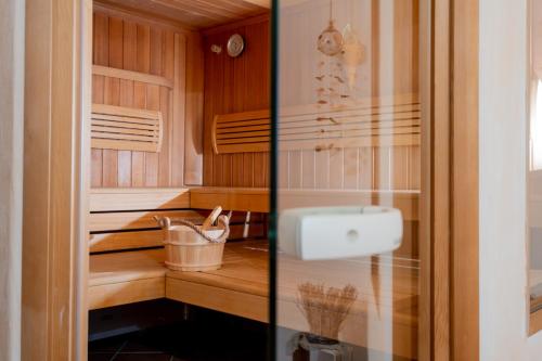 a kitchen with wooden cabinets and a sink at Harzhotel Zum Prinzen in Clausthal-Zellerfeld