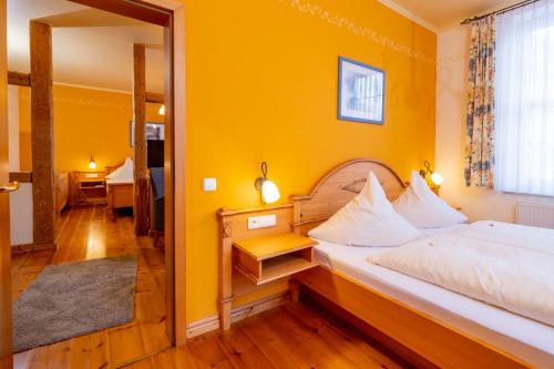 En eller flere senge i et værelse på Harzhotel Zum Prinzen