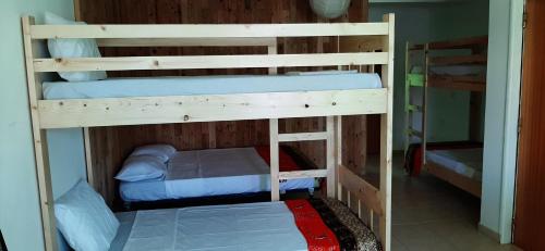 a couple of bunk beds in a room at Atlantic Sal Hostel in Santa Maria