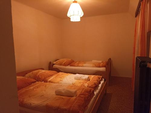 Postel nebo postele na pokoji v ubytování Statek Straňovice Apartmán 2 velký