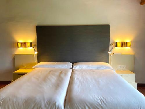 Ένα ή περισσότερα κρεβάτια σε δωμάτιο στο Hotel Boutique Convento San Diego