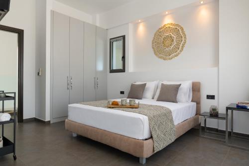 Ένα ή περισσότερα κρεβάτια σε δωμάτιο στο Alindo Villa I