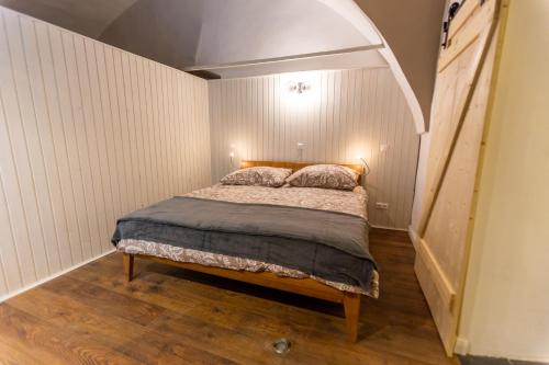a bedroom with a bed in a room with an attic at Ferien- und Pferdegut Schloss Treffen in Görtschach