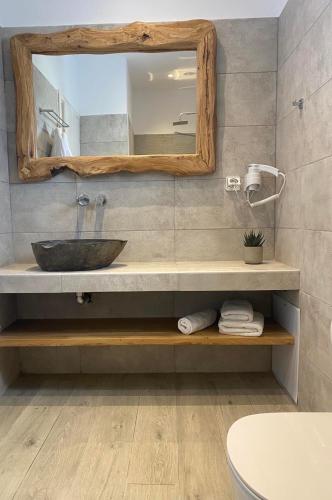 a bathroom with a sink and a mirror at Chill Out Studio in Mýkonos City