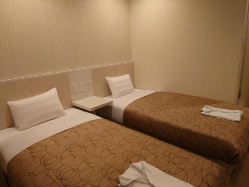 Cama ou camas em um quarto em Hotel Relief SAPPORO SUSUKINO - Vacation STAY 22963v