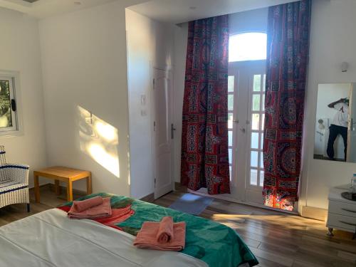 Voodi või voodid majutusasutuse The Mango Guest House toas